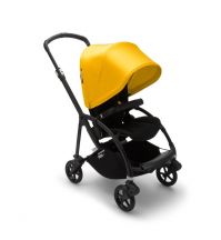 A front-facing stroller with a bright yellow canopy 